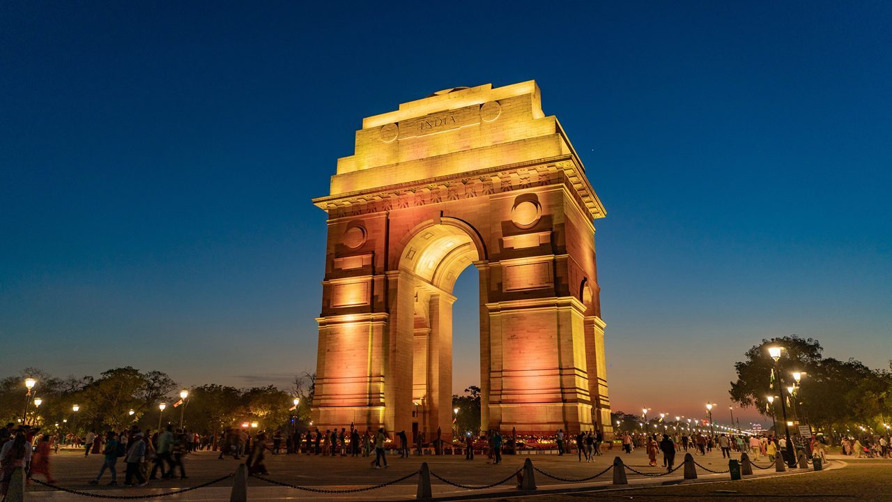 Delhi — India Gate illuminated at dusk